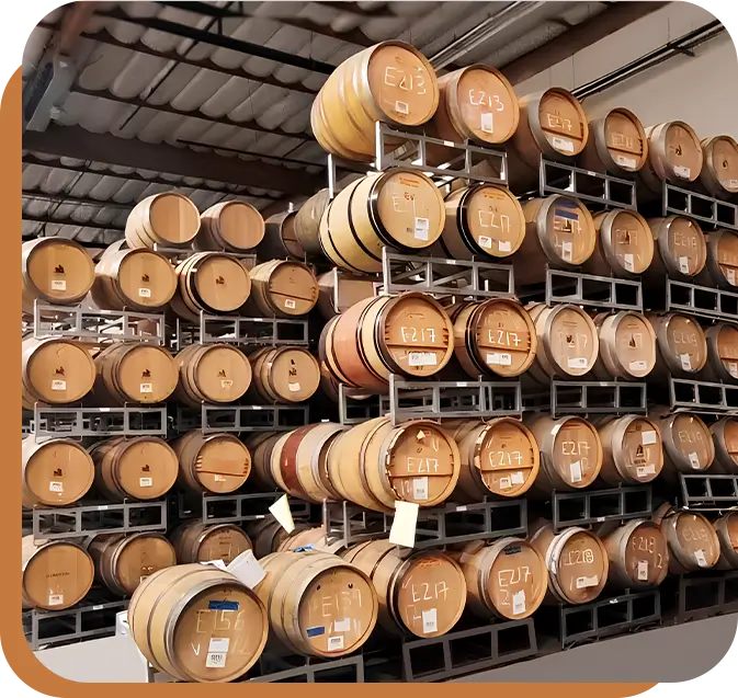 A large amount of barrels stacked on top of each other.